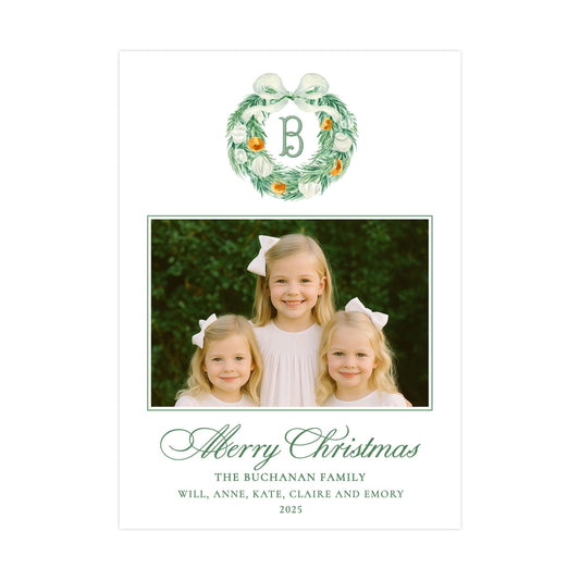 The image is a Christmas card featuring three young girls with bows in their hair, posing for a photograph. The card has a wreath design above the photo and a message at the bottom.