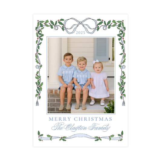 A family portrait of three children sitting on a porch, with a decorative border and text at the bottom.