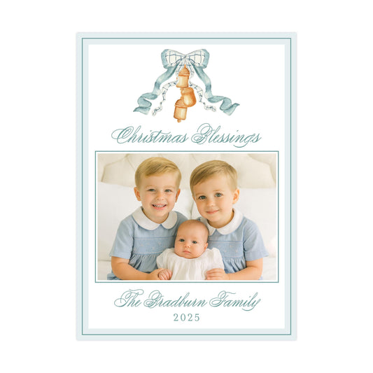 The image is a Christmas card featuring two young boys and a baby, with a bow and bells as decorative elements. The card is titled "Christmas Blessings" and includes the text "The Gradson Family" and "2025".