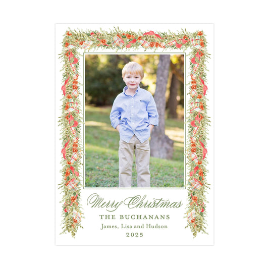 A young boy wearing a blue shirt and khaki pants stands in a park, surrounded by a decorative frame with a floral border.
