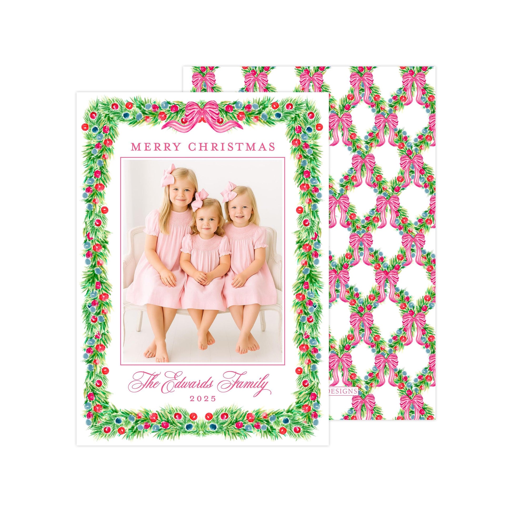 A Christmas card featuring three young girls in pink dresses, with a festive wreath border and the text "Merry Christmas" and "The Edwards Family, 2020" printed on it.