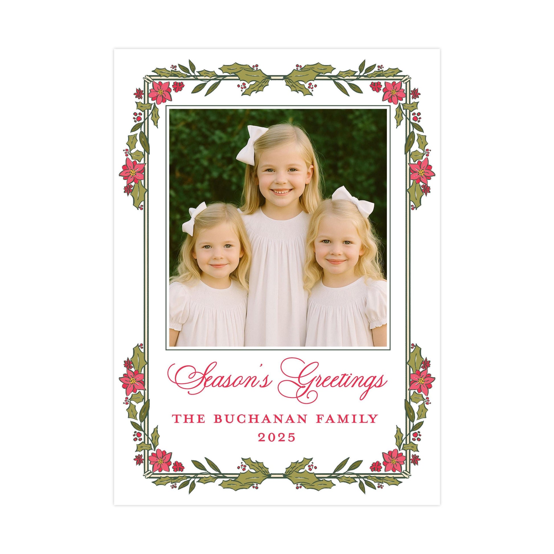 A family portrait of three young girls in white dresses, with a floral border around the edges. The text below the photo reads &quot;Season&#39;s Greetings The Buchanan Family 2025&quot;.