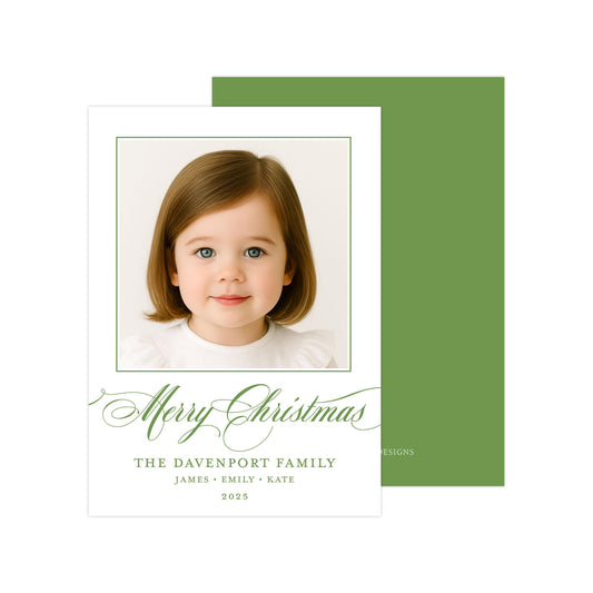 A white card with a green border, featuring a photograph of a young girl with brown hair and blue eyes. The card has a green background and a green border, and includes a message that reads "Merry Christmas" and "The Davenport Family".