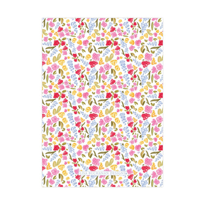 The image is a colorful and vibrant pattern featuring various flowers and leaves in shades of pink, yellow, and green.