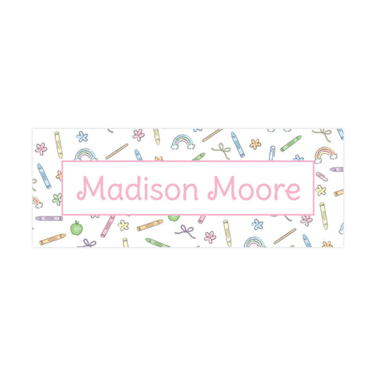 The image is a banner with the name "Madison Moore" written on it, surrounded by various colorful pencils and other school supplies.