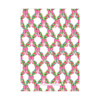 a repeating pattern of pink bows and green leaves on a white background.