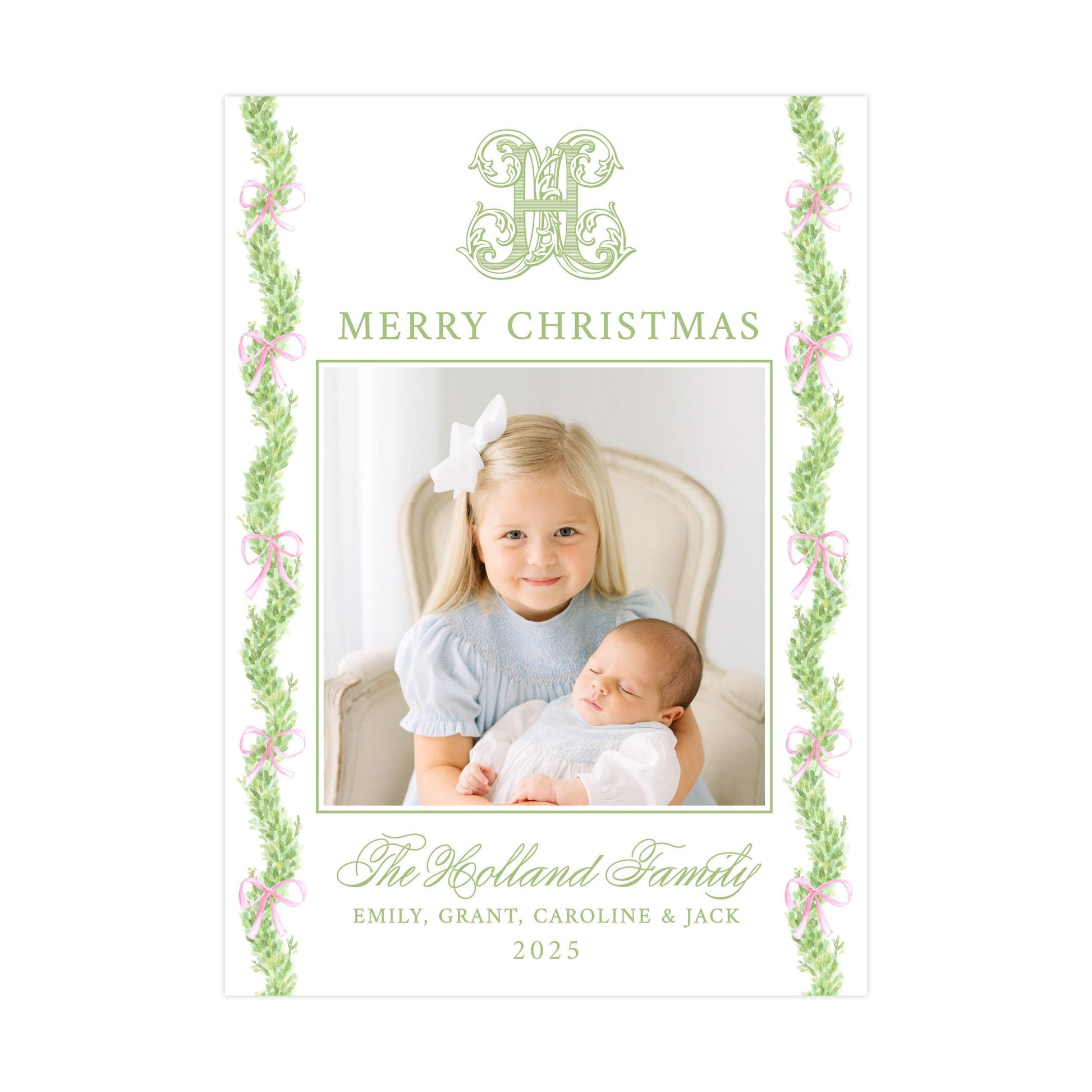 a young girl holding a sleeping baby, with a decorative border of greenery and pink ribbons around the edges. The text at the top reads &quot;MERRY CHRISTMAS&quot; and the text at the bottom reads &quot;The Kolland Family&quot;.