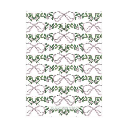 a repeating pattern of pink bows and green holly leaves on a white background.