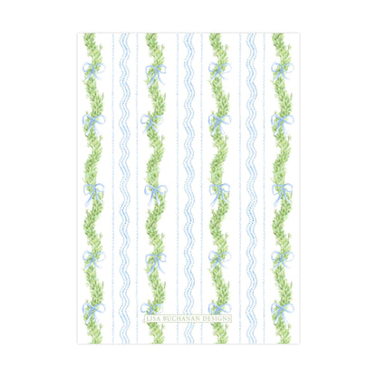 a repeating pattern of green leaves and blue ribbons, creating a visually appealing and decorative design.
