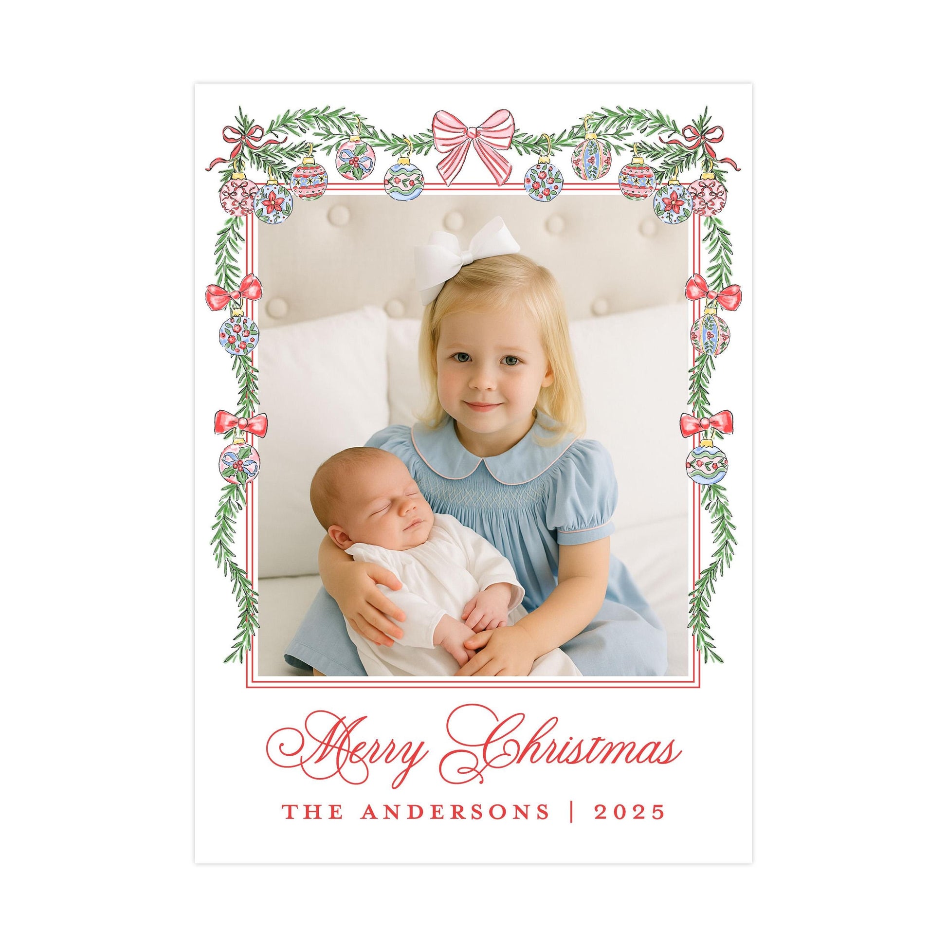 A young girl in a blue dress is holding a sleeping baby in her arms, with a festive Christmas-themed frame surrounding them. The text &quot;Merry Christmas&quot; and &quot;THE ANDERSons | 2025&quot; is visible, indicating the holiday season and the name of the family.