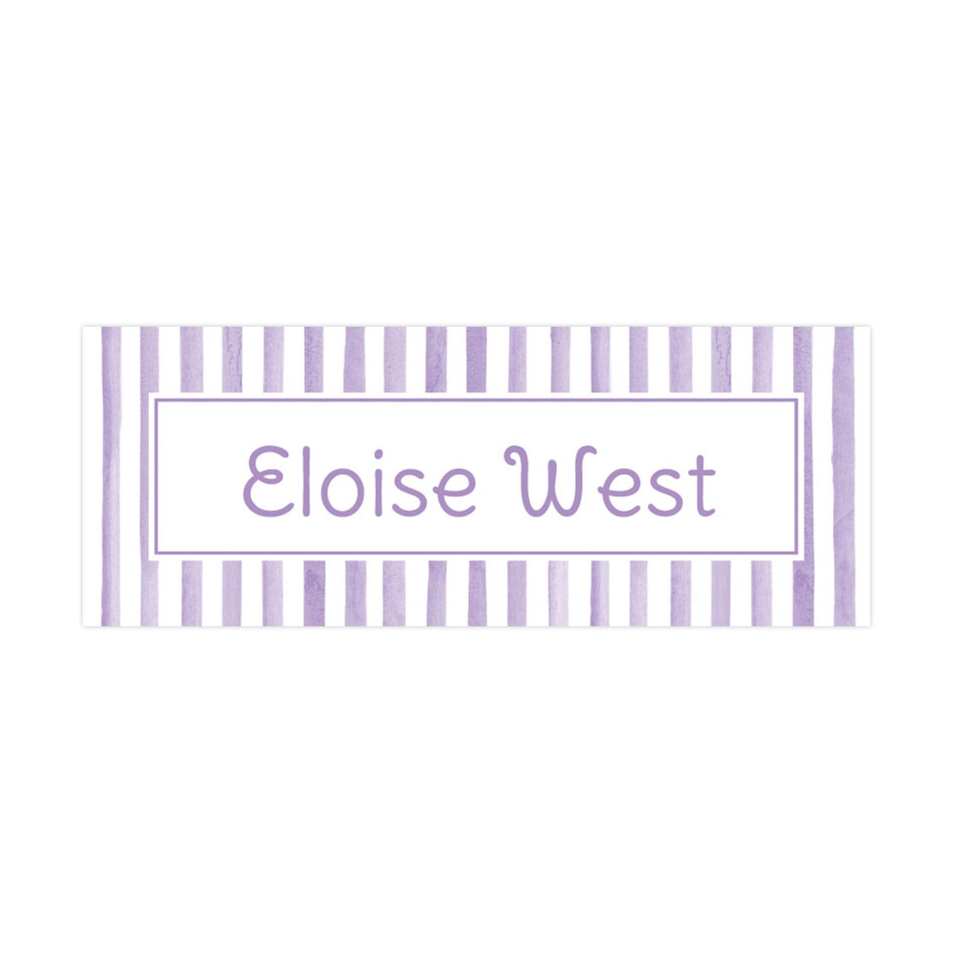 a rectangular label with a purple and white striped border, displaying the name &quot;Eloise West&quot; in a simple, sans-serif font.
