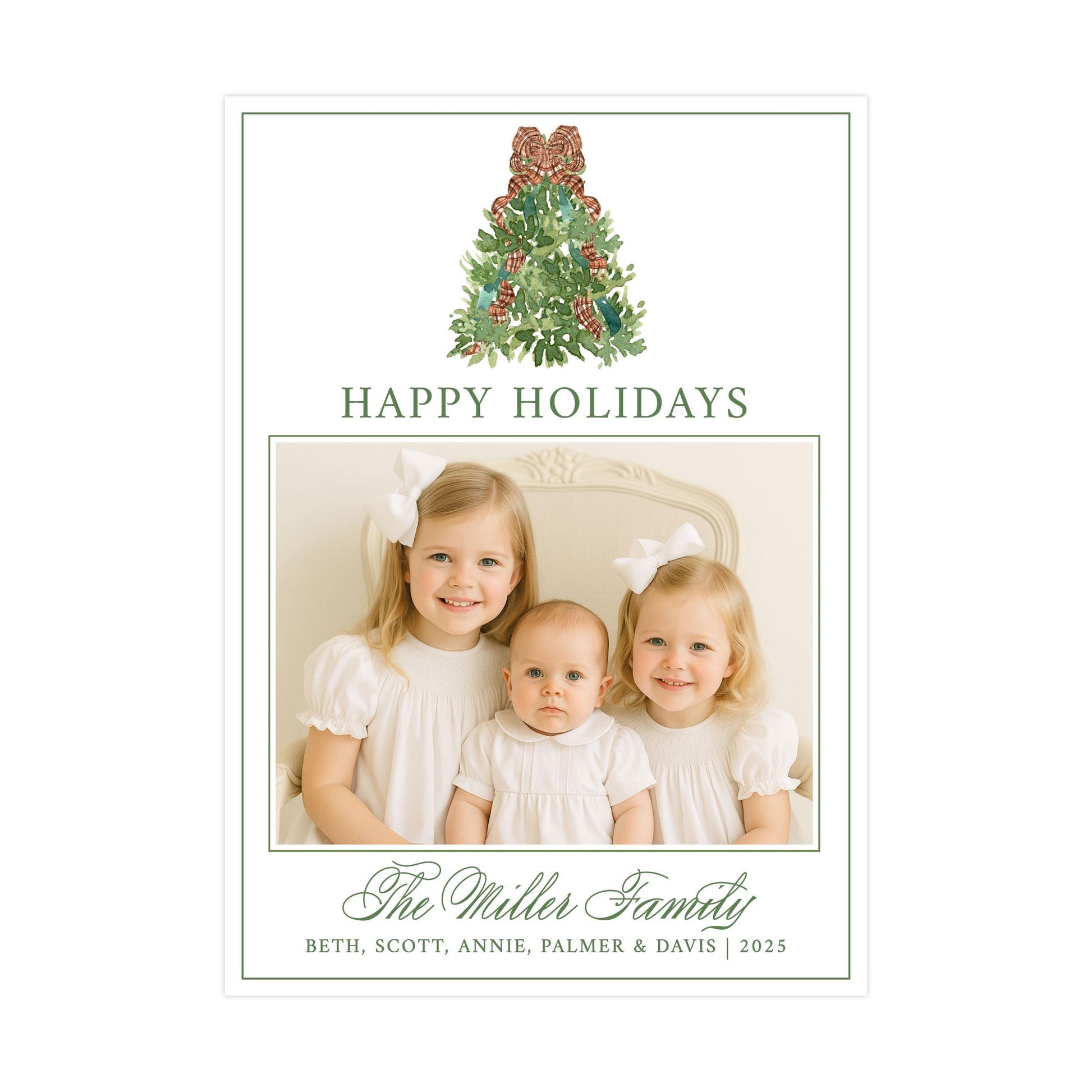 A family portrait of three young girls, likely sisters, with a Christmas tree in the background. The text &quot;HAPPY HOLIDAYS&quot; is displayed above the photo, and &quot;The Miller Family&quot; is written below the photo.
