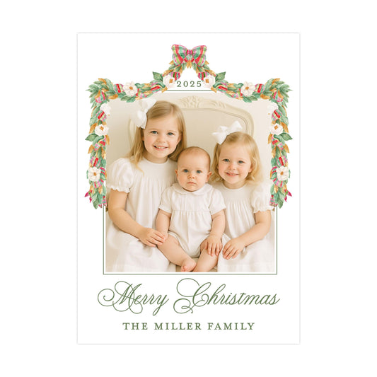 A family portrait of three young girls in white dresses, with a floral border and the text &quot;Merry Christmas&quot; and &quot;The Miller Family&quot; at the bottom.