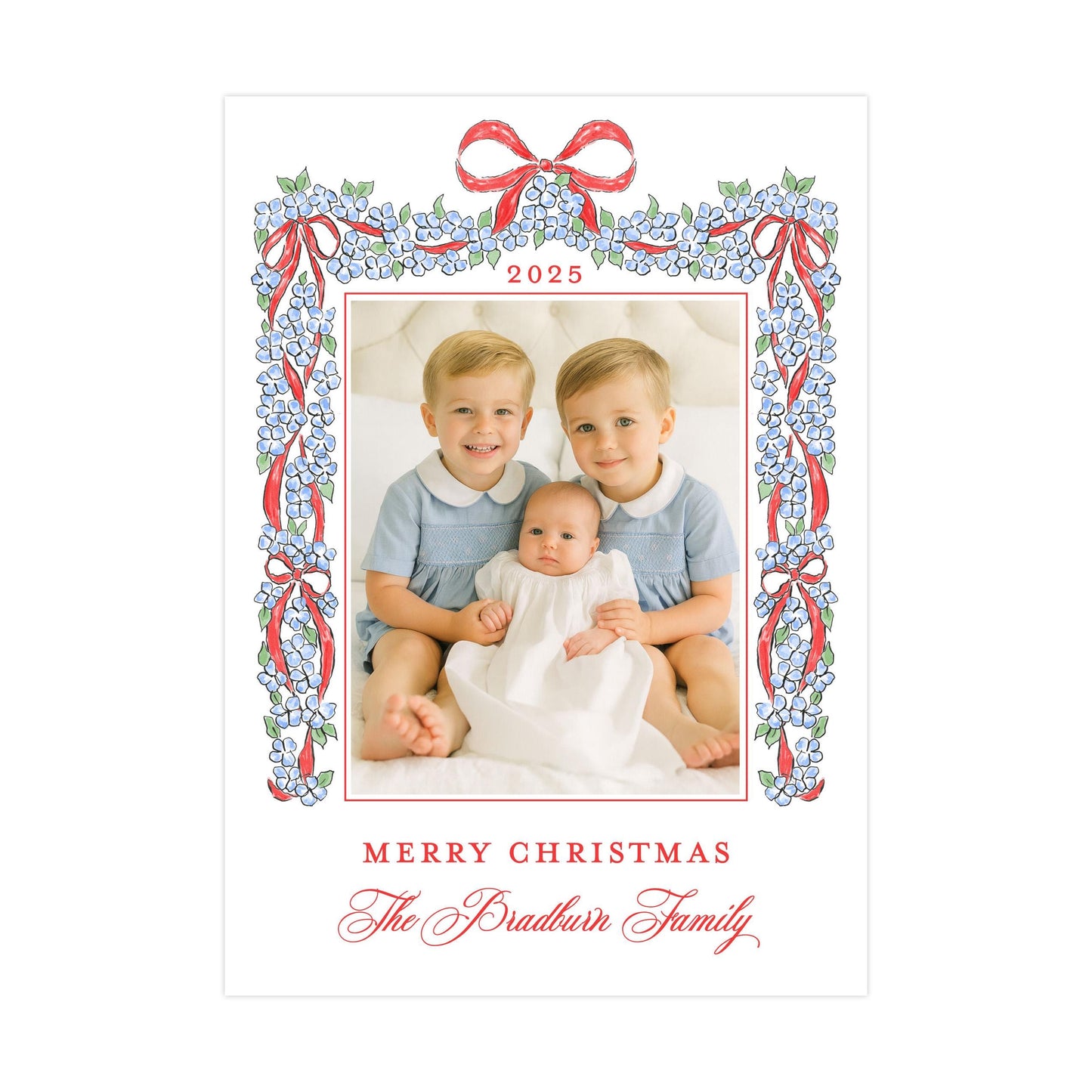 A family portrait of two young boys and a baby, framed by a decorative border with a floral pattern and red ribbons. The text at the bottom of the image reads &quot;Merry Christmas The Bradtun Family&quot;.