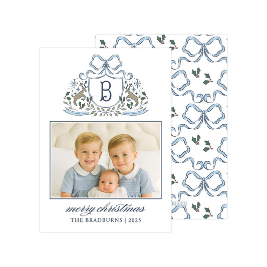A family photo of two young boys and a baby, with a decorative border and text that reads "Merry Christmas THE BRADBURNS | 2025".