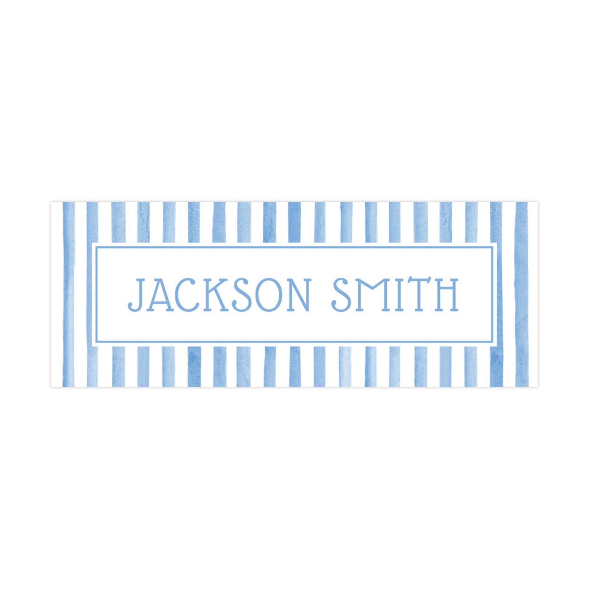 A rectangular sign with the name &quot;JACKSON SMITH&quot; written in a blue and white striped pattern.