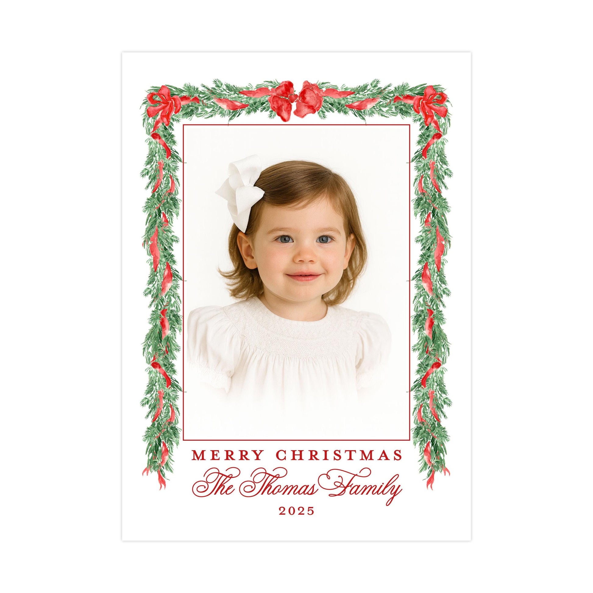 A young girl with a white bow in her hair is the central focus of the image, framed within a decorative border of red and green leaves and flowers. The text &quot;Merry Christmas The Thomas Family 2020&quot; is displayed around the border, indicating the holiday season and the family&#39;s name.