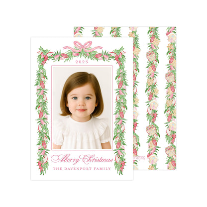A young girl with brown hair is smiling at the camera, framed by a decorative border with a floral pattern. The text "Merry Christmas" and "The Davenport Family" is displayed below the photo.