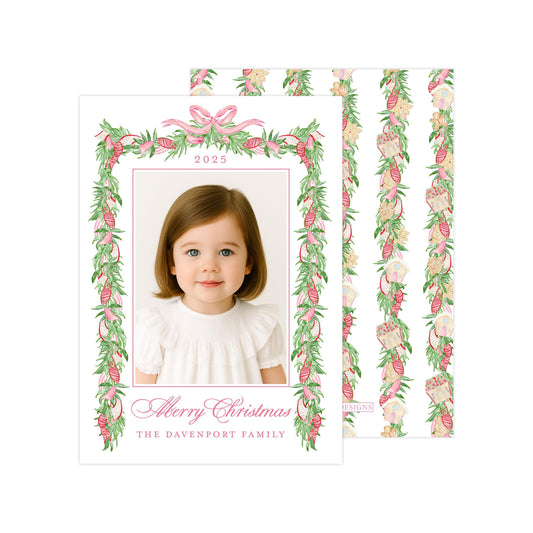A young girl with brown hair is smiling at the camera, framed by a decorative border with a floral pattern. The text "Merry Christmas" and "The Davenport Family" is displayed below the photo.