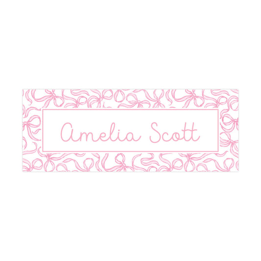 a pink and white floral pattern with the name "Amelia Scott" written in cursive on a white background.