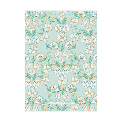 a repeating pattern of white flowers with green leaves against a light blue background.