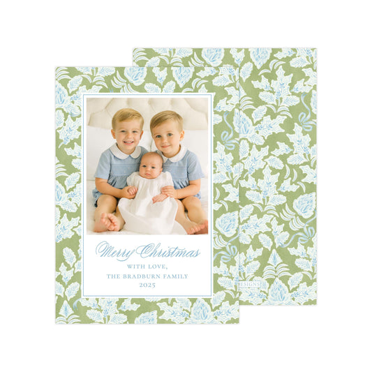 A family photo of two young boys and a baby, with a floral patterned background. The text below the photo reads &quot;Merry Christmas with love, The Bradbury family, 2023&quot;.