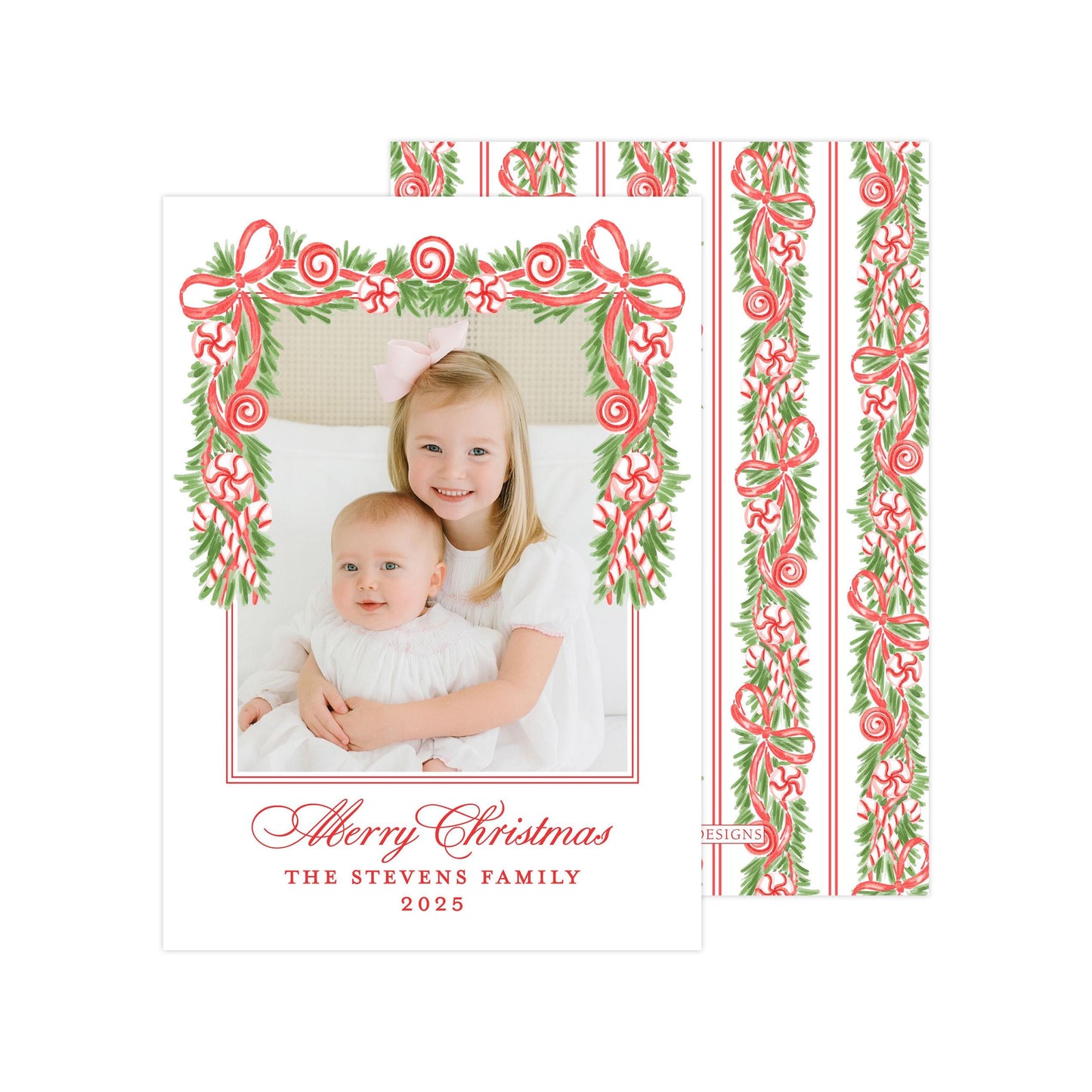 A Christmas card featuring two young girls, one wearing a white dress and the other in a white outfit, with a festive border of red and green ribbons and greenery. The card has a personalized message and year, and the image is described as a collage of multiple images.