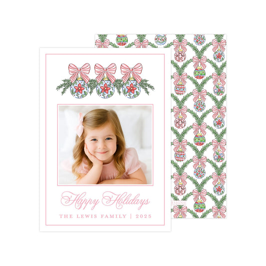 A holiday card featuring a young girl with a bow in her hair, surrounded by festive decorations and a pattern of pink and green bows.