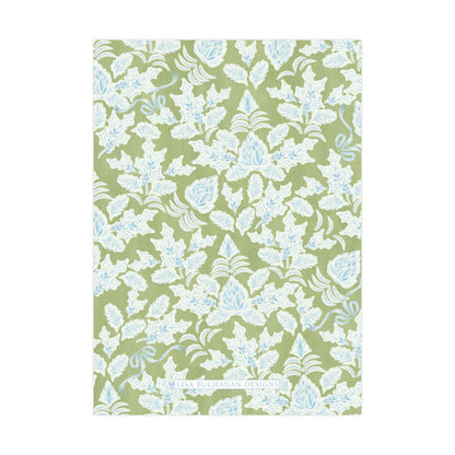 a repeating pattern of white leaves and flowers on a green background.